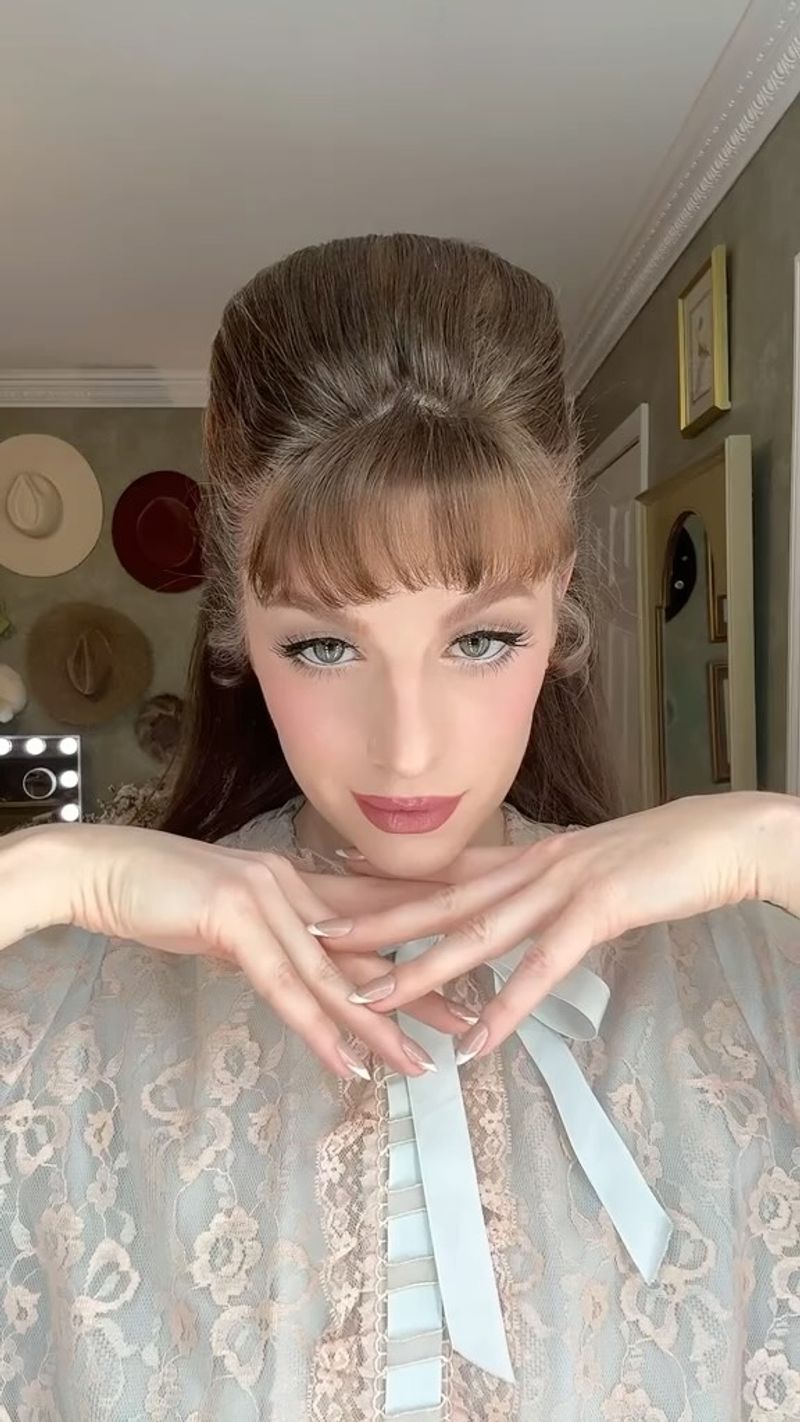 Winged Eyeliner And Peach Lips