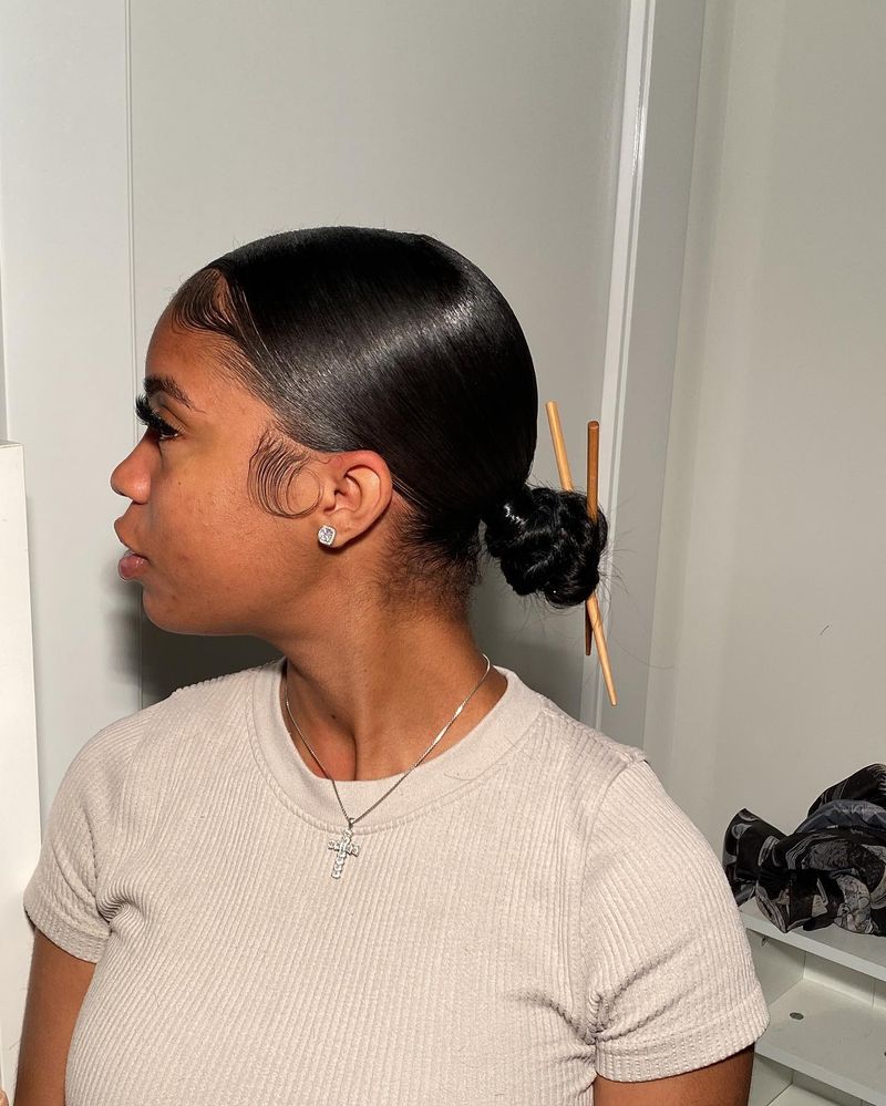 Low Bun With Side Swoop