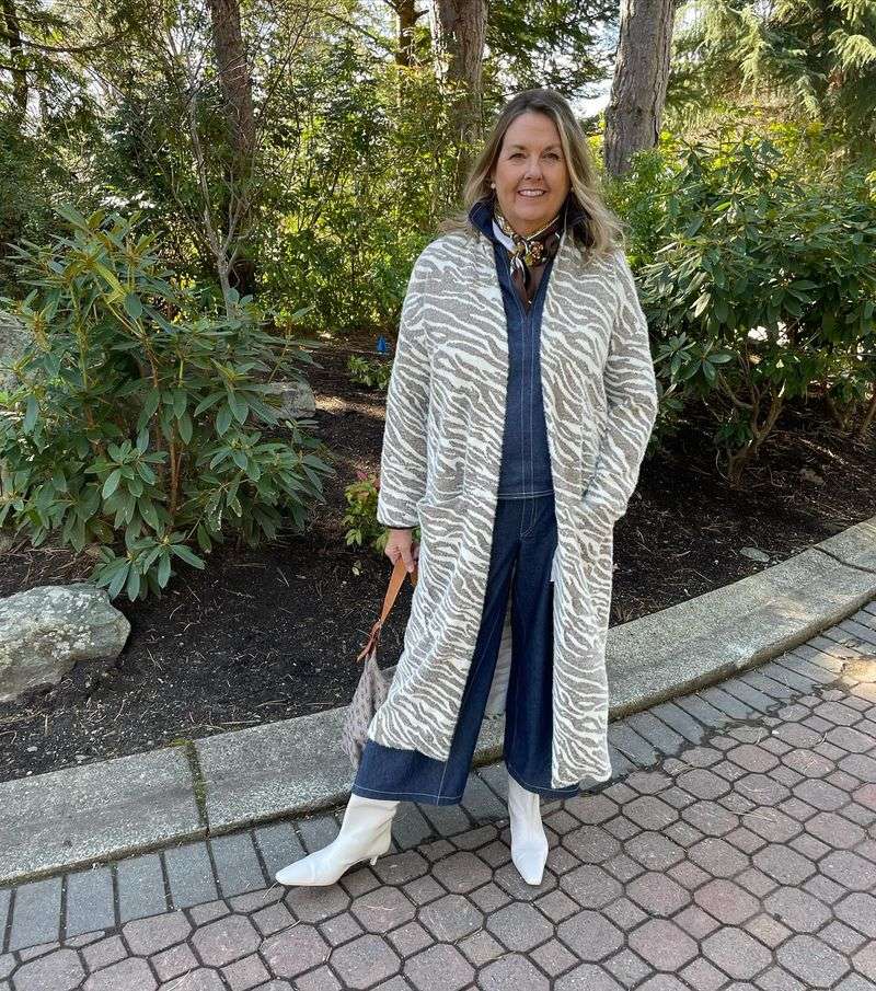 Camel Coat Over A Simple Black Dress
